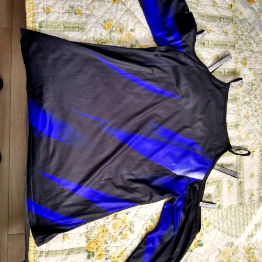 Woman's shirt size L. Never worn, no tags.